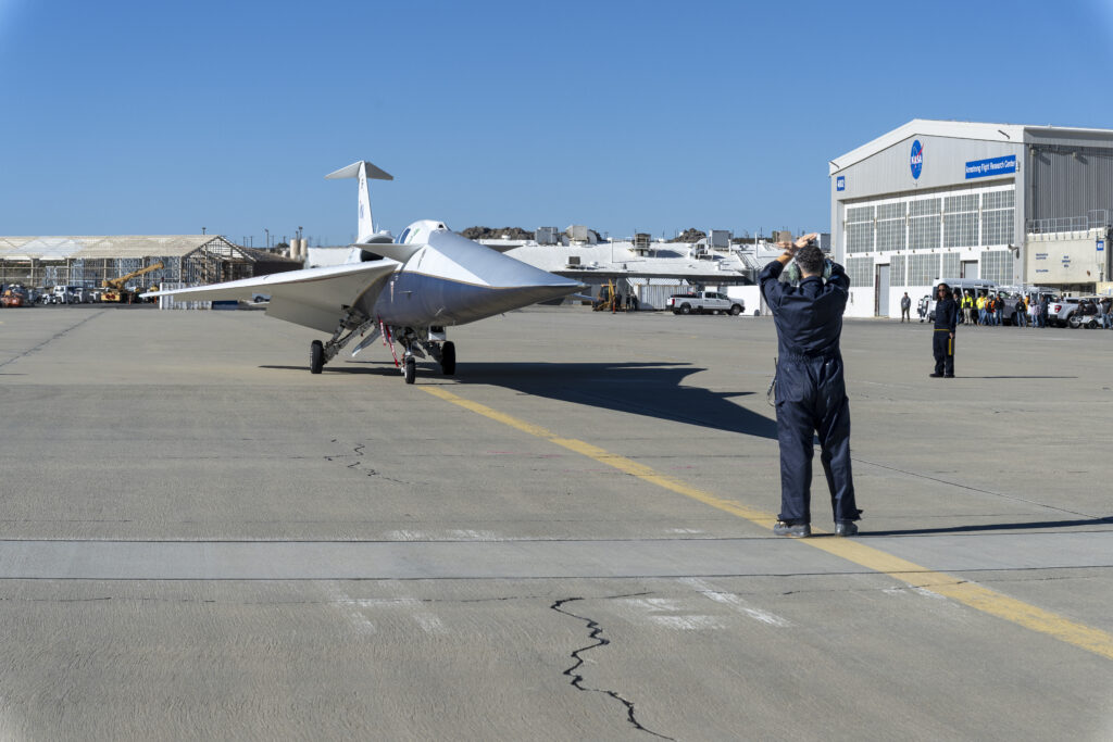 The X-59 quiet supersonic research aircraft arrives at NASA’s Armstrong Flight Research Center in Edwards, California, following its first flight Tuesday, Oct. 28, 2025. The arrival marks the aircraft’s transition from ground testing to flight operations. Next, the aircraft will undergo scheduled maintenance followed by a series of additional test flights, gradually building toward its first supersonic flight.